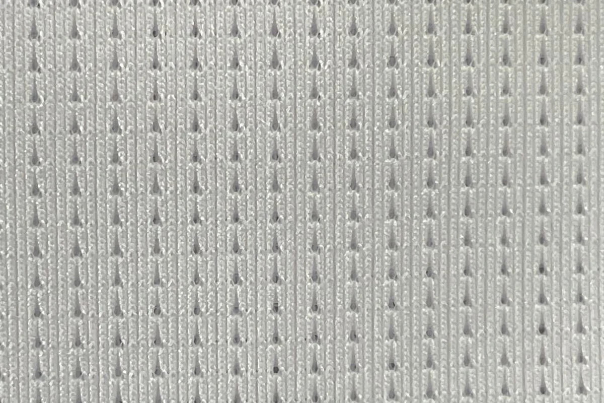Stretch activewear fabric with knit surface detail