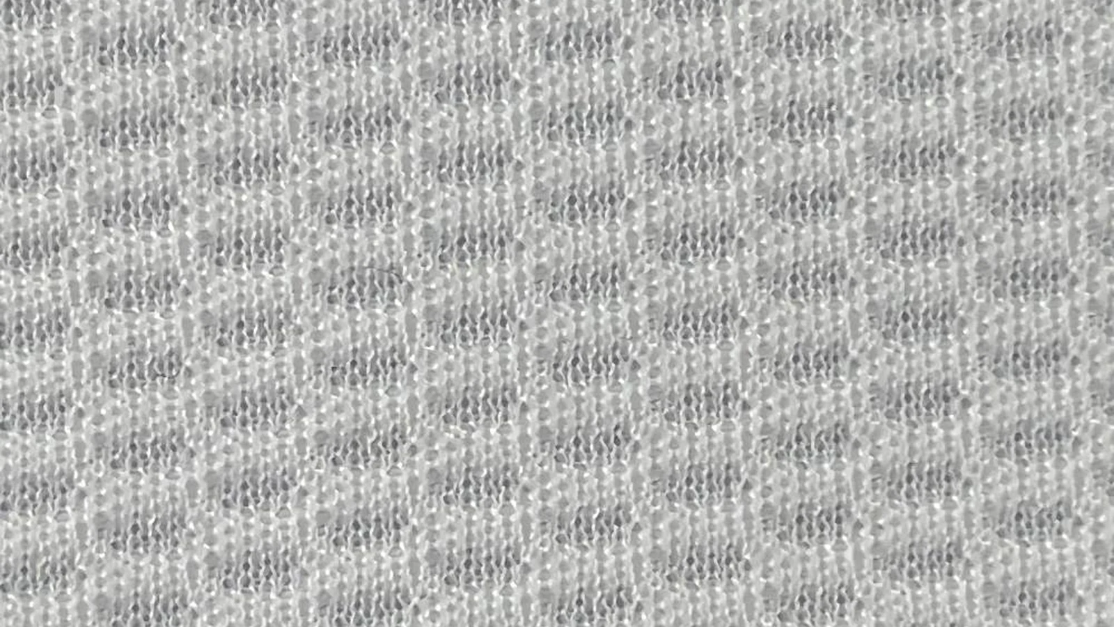Close-up texture detail of white performance birdseye jersey fabric KWC0001, breathable knit structure.