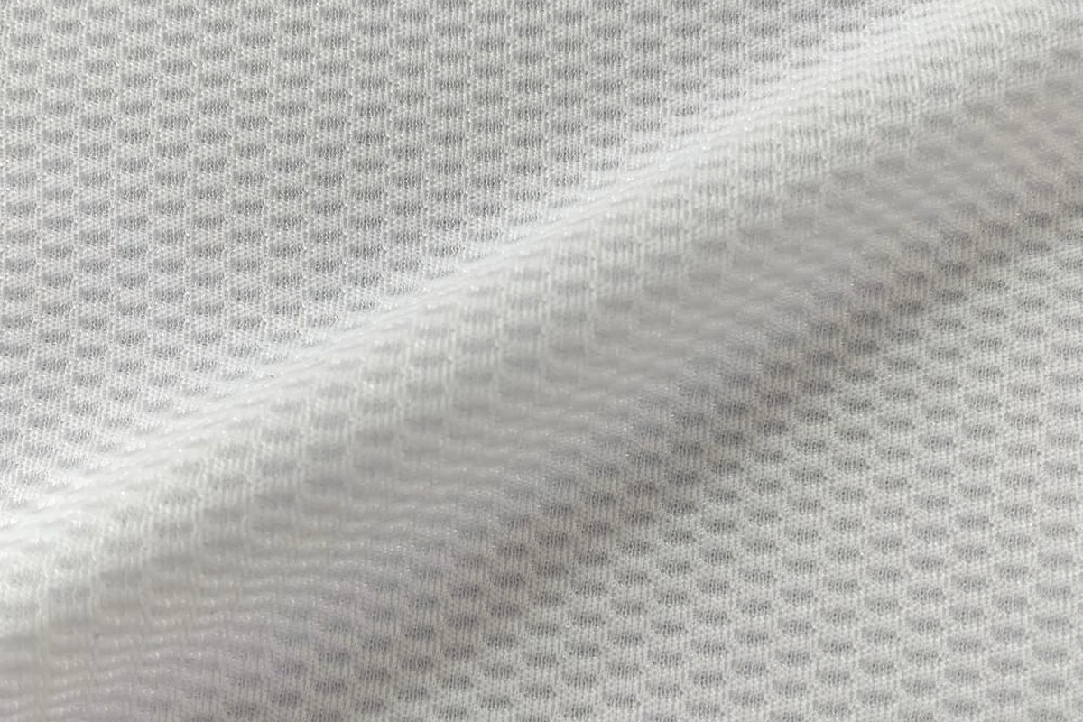 Flat view of white performance birdseye jersey fabric KWC0001 for activewear tops and t-shirts, 160gsm.