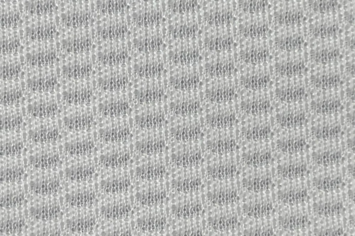 Close-up texture detail of white performance birdseye jersey fabric KWC0001, breathable knit structure.