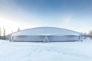Translucent fabric sports structure in winter daylight
