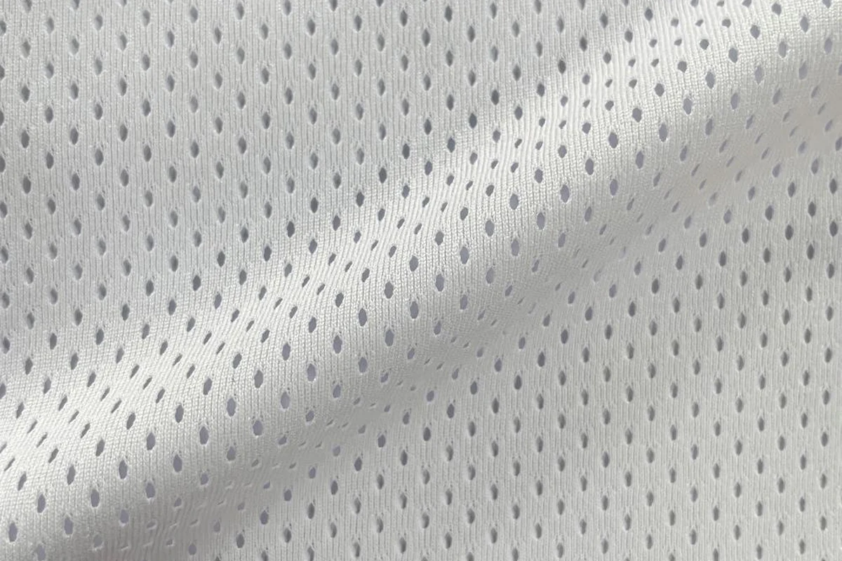 Draped white 100% polyester lightweight drop-needle mesh lining fabric, vertical slit hole texture, item SY22091, 120gsm
