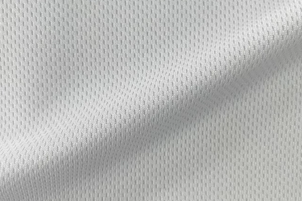 Draped white 100% polyester 75D birdseye mesh lining fabric, soft pin dot texture, item SY013, 150gsm