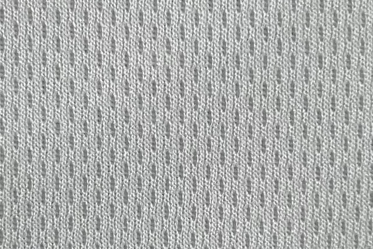 Performance fabric close-up with breathable knit structure