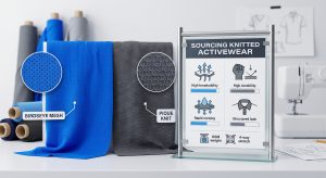 A technical B2B textile display comparing performance knitted activewear fabrics. On the left, a vibrant blue Birdseye Mesh fabric with a magnified inset showing its micro-pinhole geometry for maximum ventilation. On the right, a charcoal gray Pique Knit with a magnified inset showing its honeycomb structure for durability. Integrated is a realistic infographic chart displaying visual data on breathability, moisture-wicking, structure, and GSM weight, emphasizing quality control and sourcing for sports apparel brands.